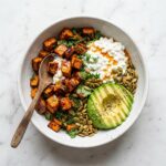 Hot Honey Cottage Cheese Sweet Potato Bowl Recipe - Hot Honey Cottage Cheese Sweet Potato Bowl Recipe served in a white bowl overhead view